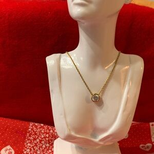 Gold Tone Necklace with Crystal Pendant.